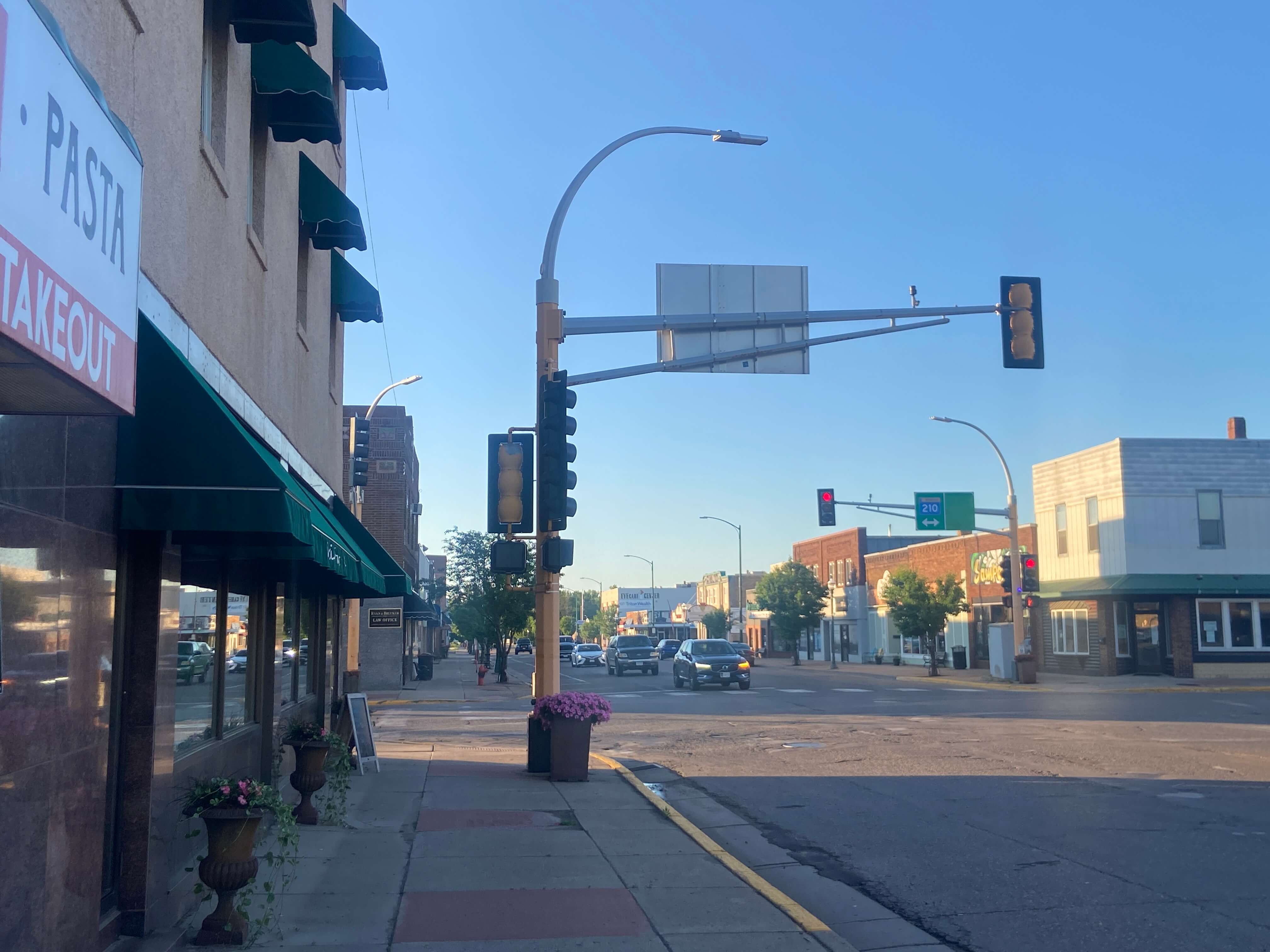 Businesses on Minnesota Avenue with Voyageur Hwy crossing Aitkin, Minnesota, USA